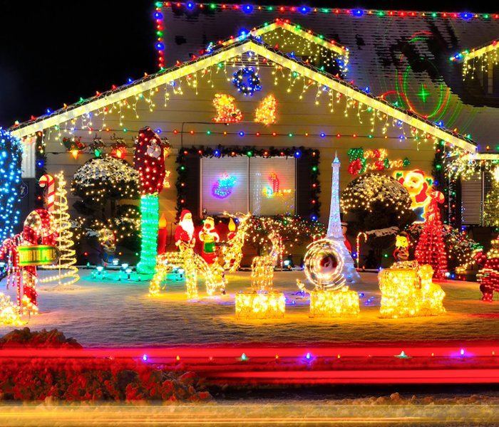 A home lit up with various holiday lights