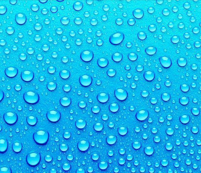 Water droplets with blue background